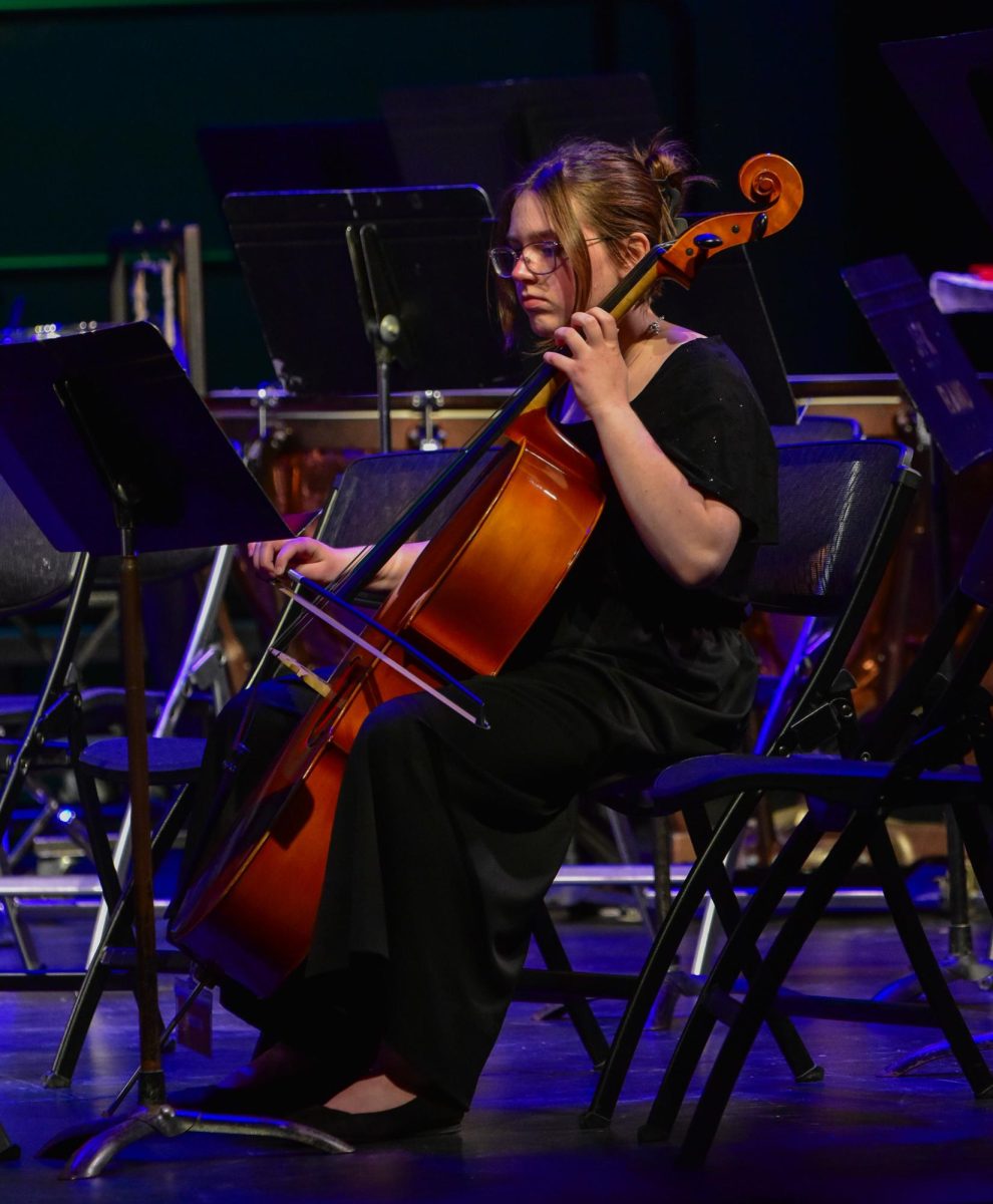Playing the cello for Concert Orchestra is Willa Romig.