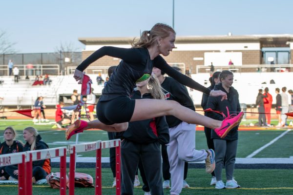 Competing hurdles for Kennedy Girls Track is sophomore Kenzie Cone.