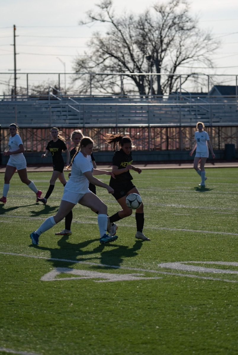 Sophomore #2 Morgan Hospodarsky and opponent fights for the ball.