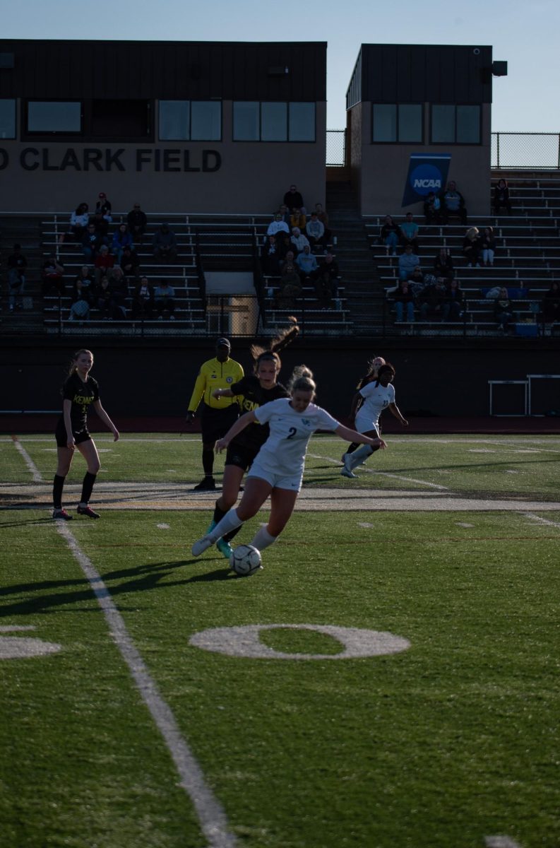 Freshman #23 Liv Boedeker tries to kick the ball out from under her opponent.