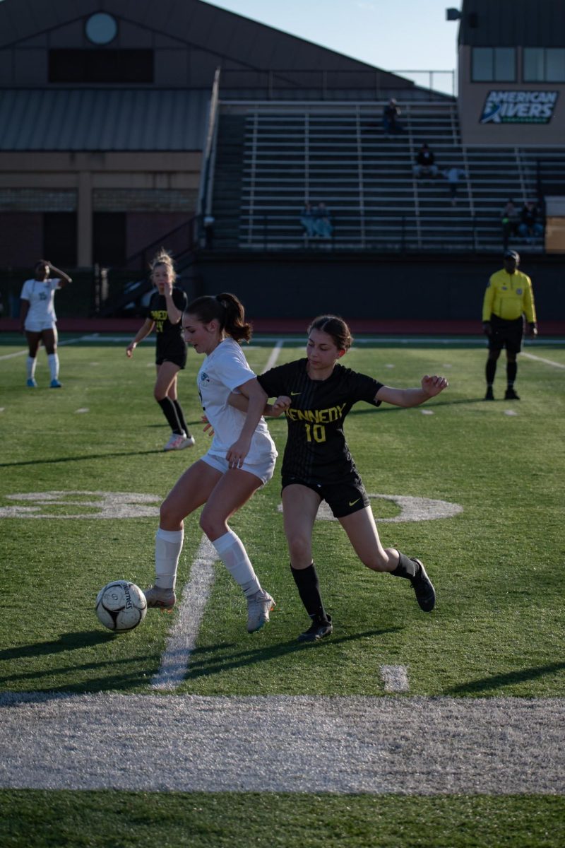 Elbowing her opponent, sophomore #10 Ayah Habhab tries to steal the ball.
