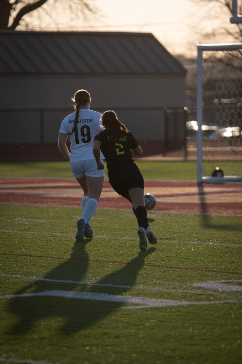 Sophomore #2 Morgan Hospodarsky follows her opponent to the goal.