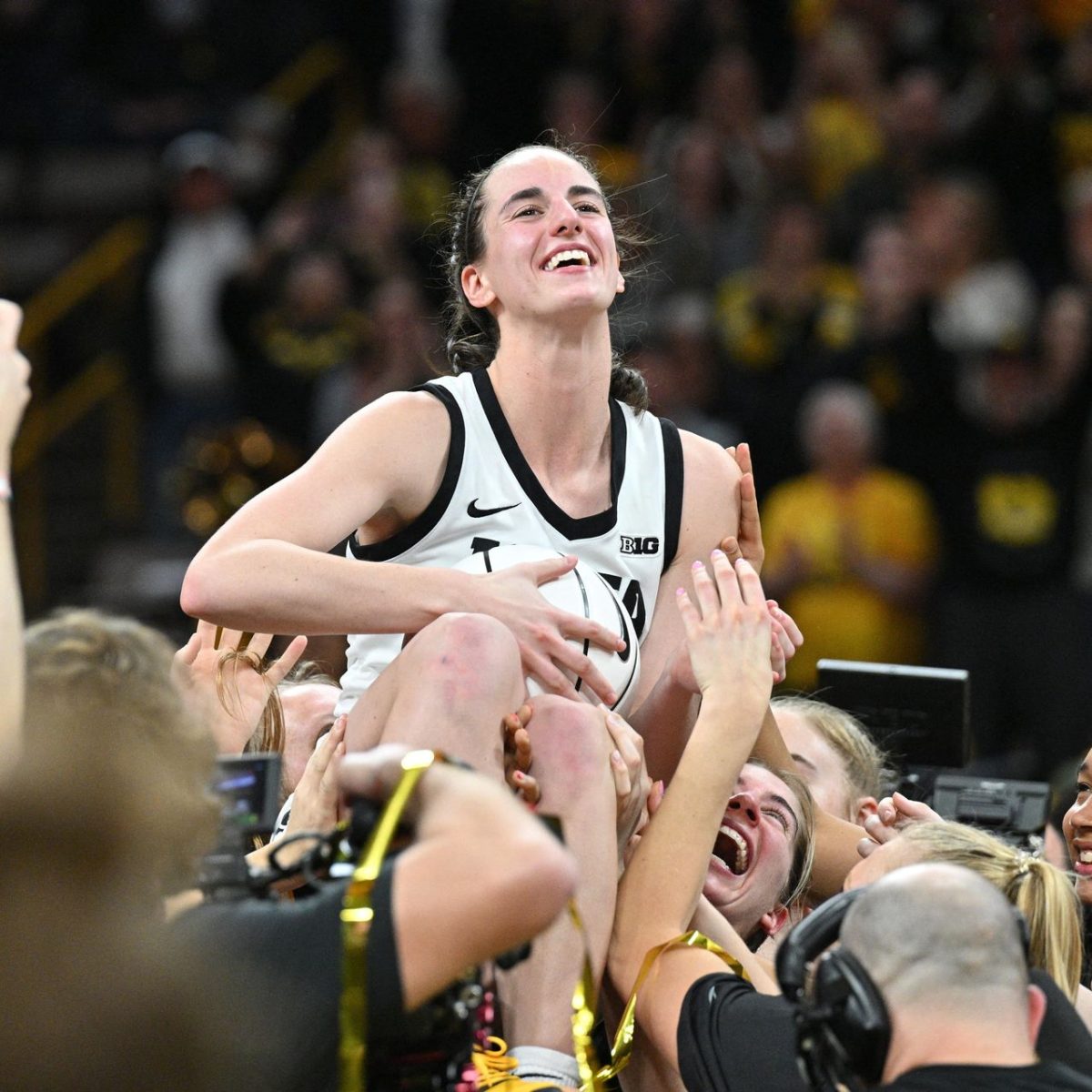 Caitlin Clark and how she has changed the trajectory of womens basketball. 