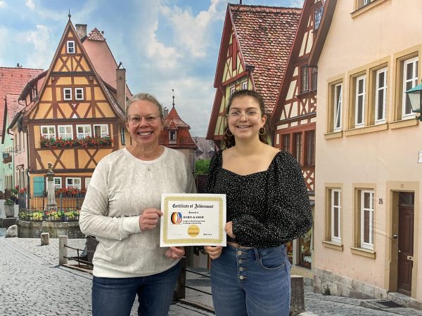 Sophomore Maria Kaiser (right) receives the CBYX Scholarship certificate from German teacher Milaena Reade (left).