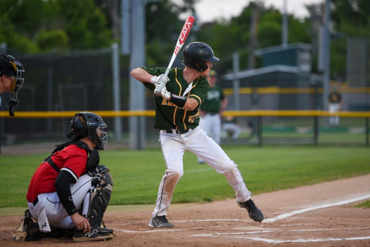 Danny Doyle swings his bat at the ball.