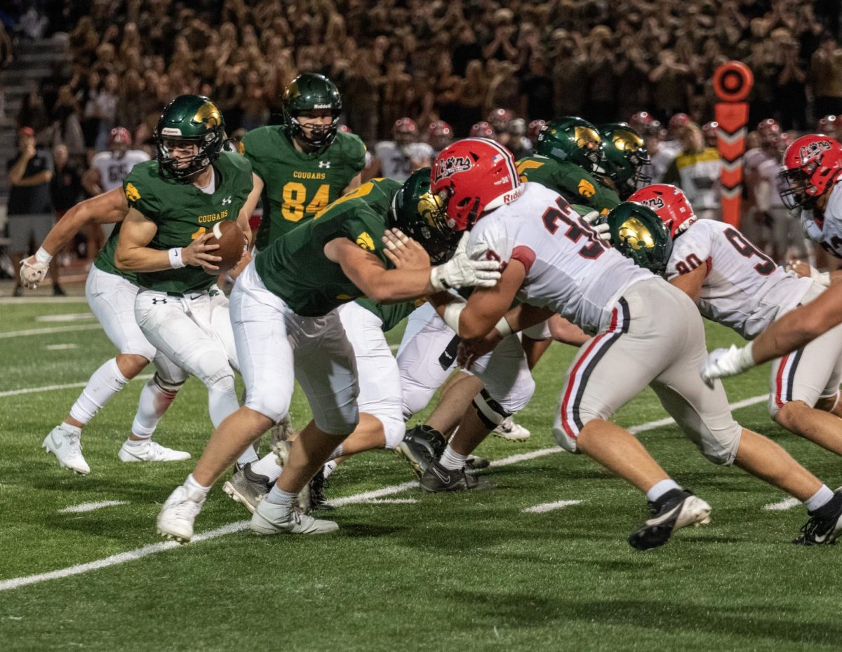 Cougar offense takes on Linn-Mar Lion defensive starters.