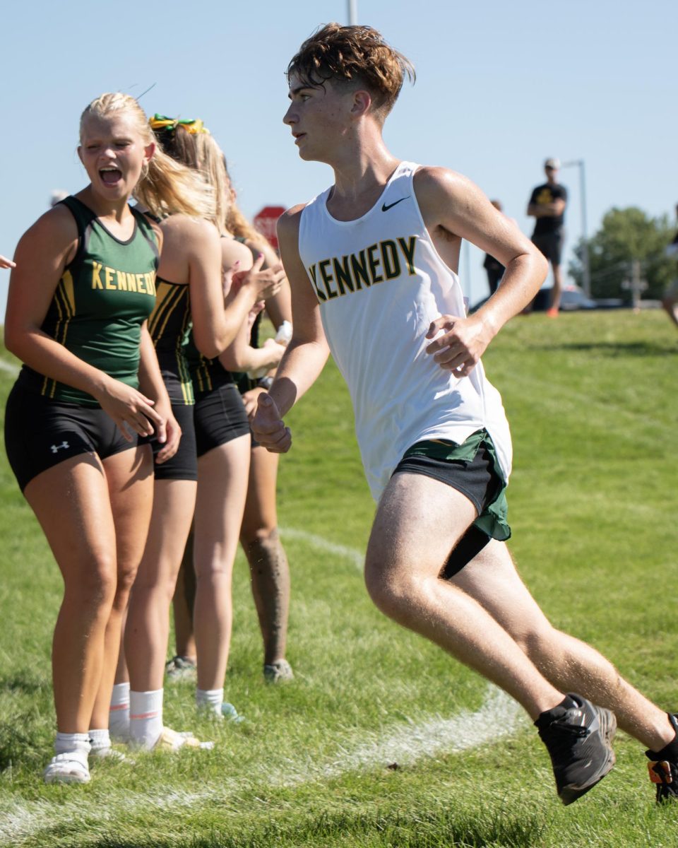 Freshman Parker Sharon is cheered to the finish line. 