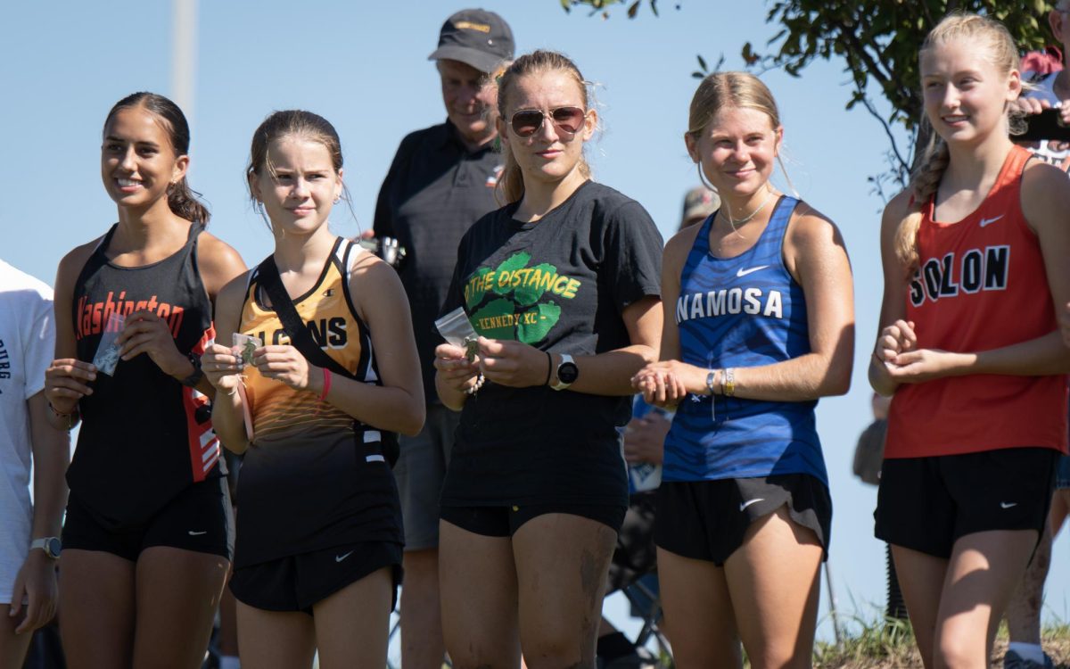 Senior Lillian Cogdill holds her medal after placing in the top 10.