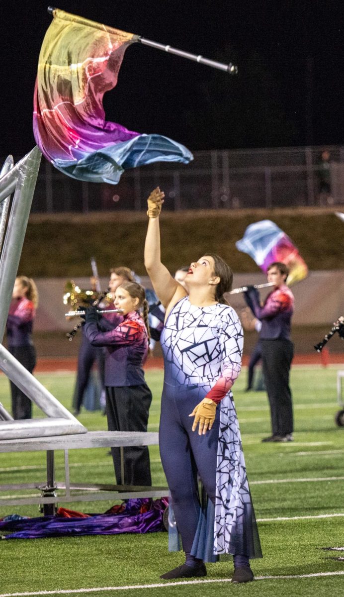 Wray executes a flag toss in the final movement of the show.