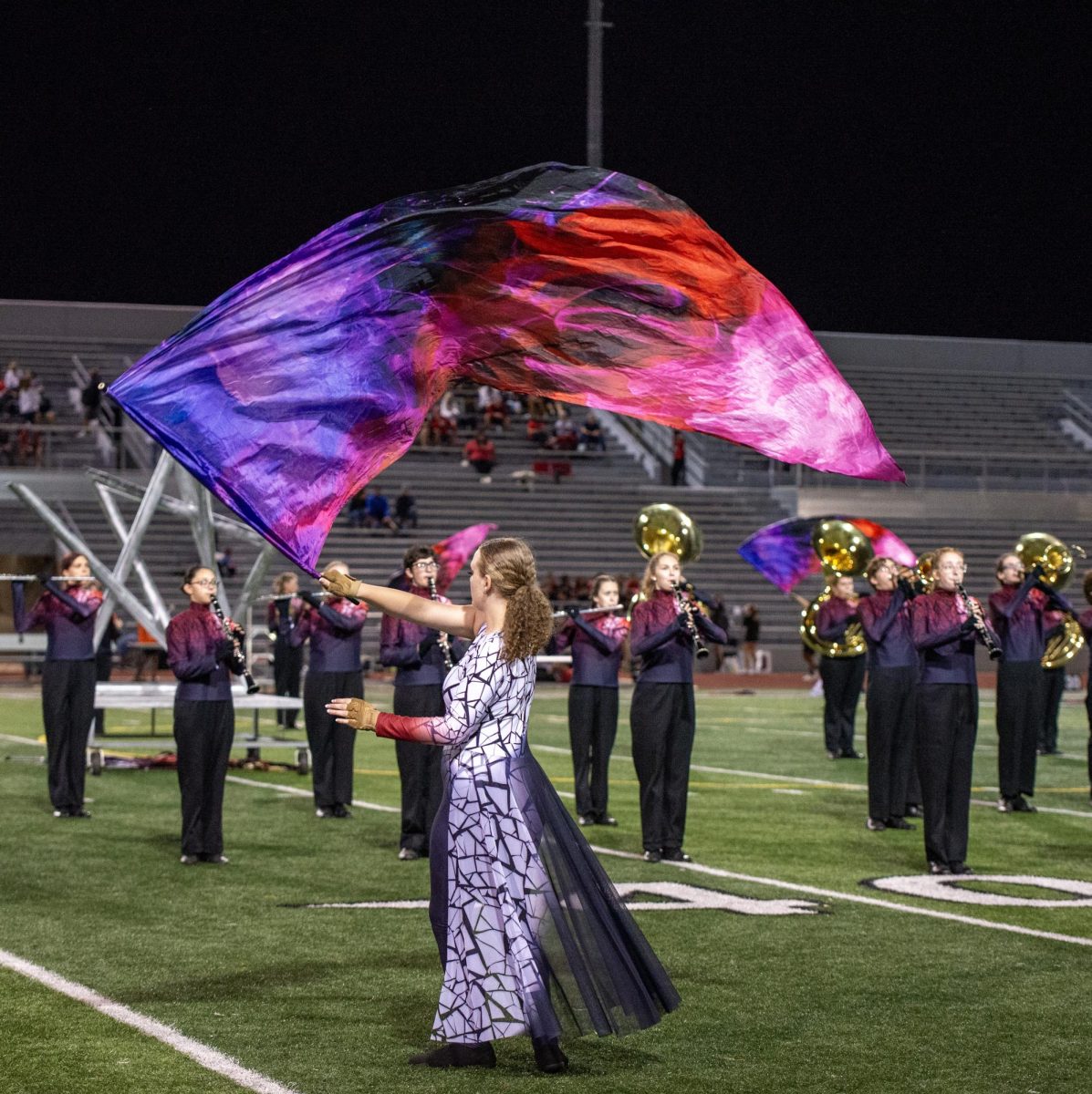 Sophomore Lilleah Bailey swings her flag though the air.