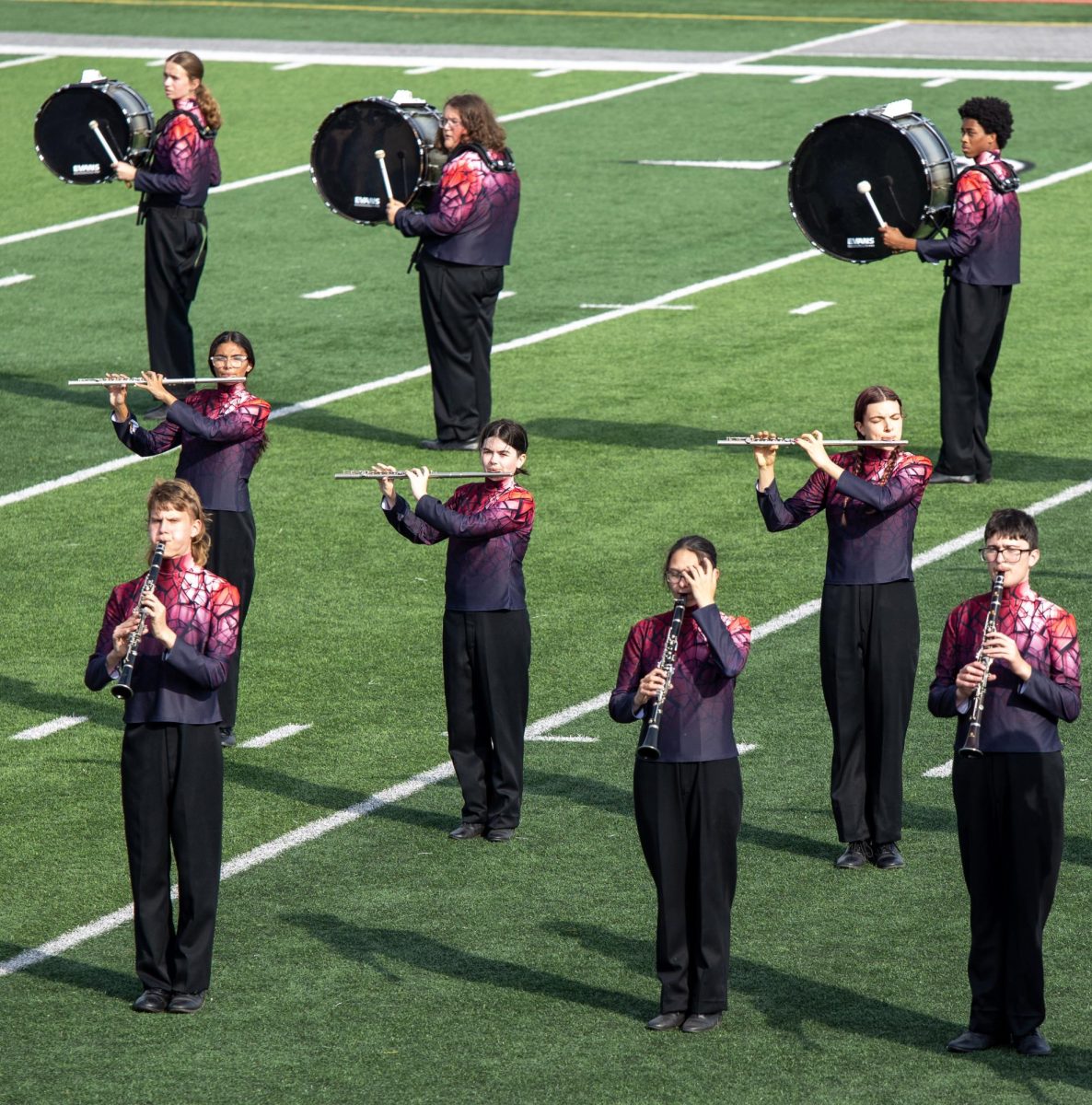 Drums, clarinets, and flute players play along during "Shattered."