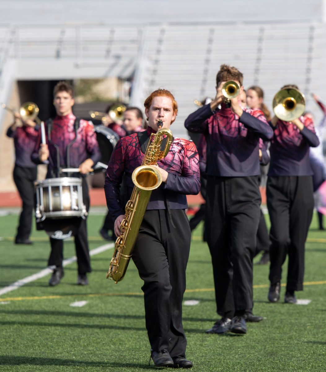 Junior Sam Stark plays his Saxophone in the front line.