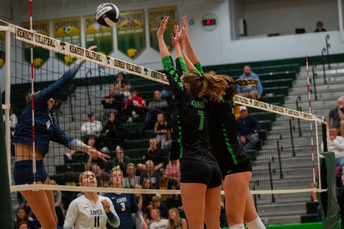 Seniors Ady Hermanson and Jenna Younge block the ball.