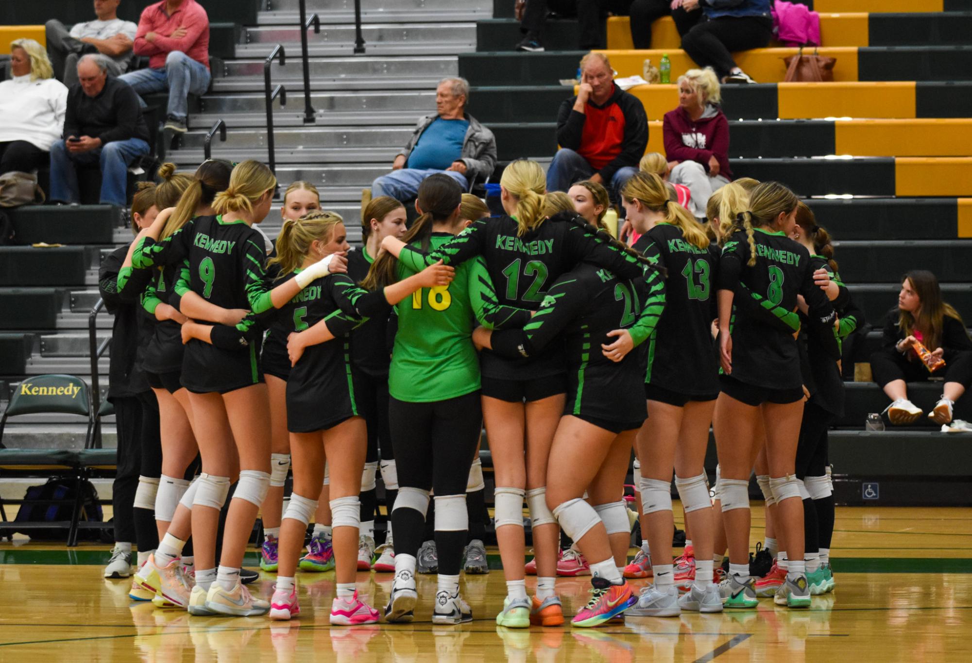 The varsity team huddles during a time out.  