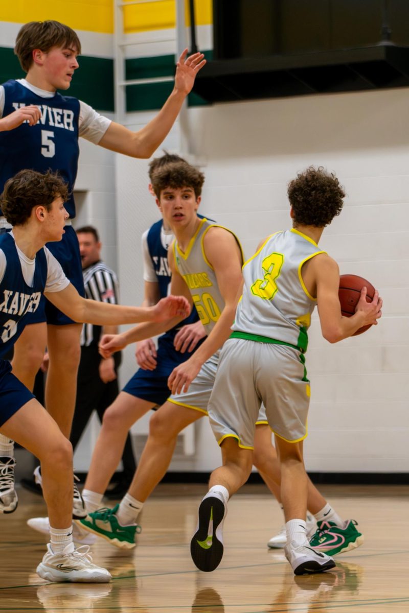 Freshman Wrigley Davidson looks to pass the ball to freshman August Wilkes.