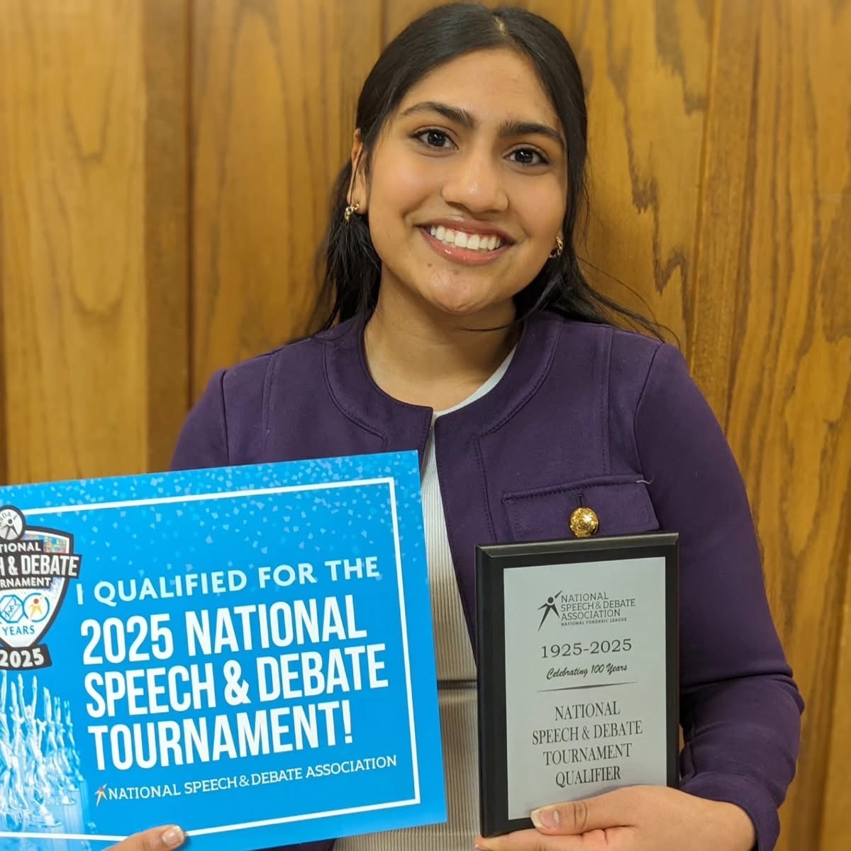 Divya Ramadugu holds up qualified 2025 National Speech & Debate Tournament certificate.