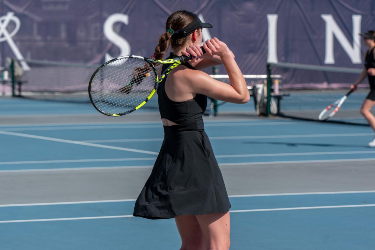 Junior Caitilyn Ruggeri prepares for the serve.  