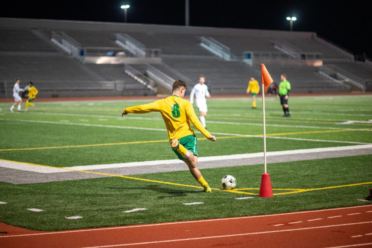Standing alone, sophomore Christian Maybanks takes a kick from the corner 