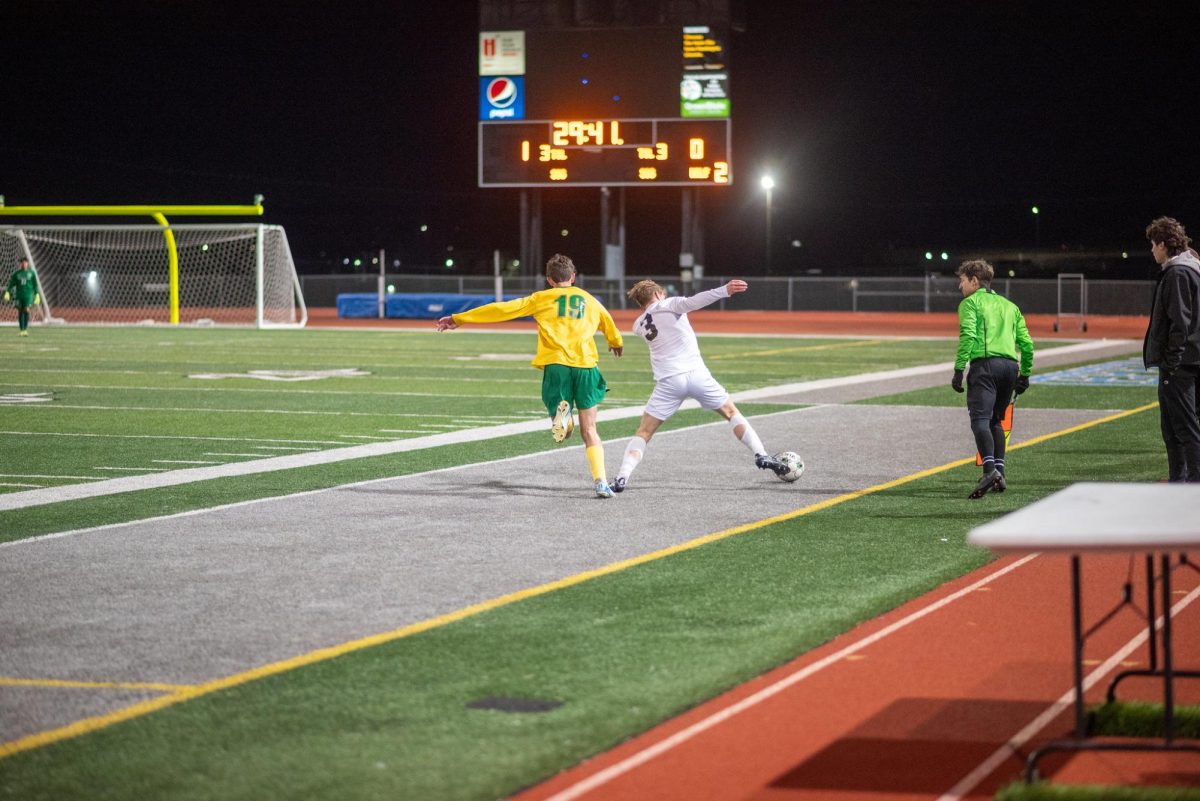 Chasing down a Waterloo West opponent, sophomore Jacob Copeland looks to free the ball.