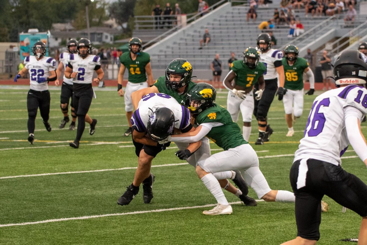 Waukee tight end brought to the ground with a group effort from seniors Jace Popenhagen and Jett Ousley. 