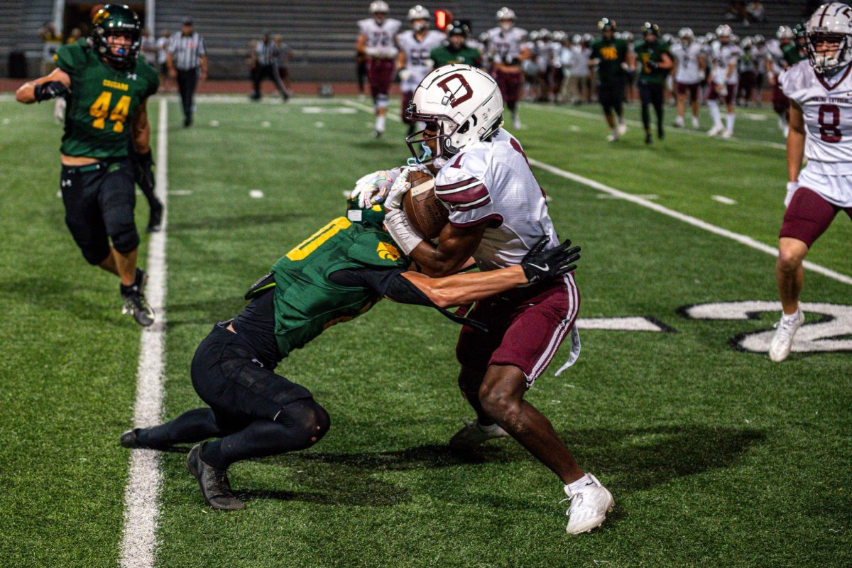 Standing up Dowling receiver, linebacker Jackson Goslin makes the tackle. 