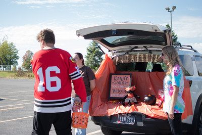 Best Buddies member, Brody Murphy, engages in conversation with friends at Trunk or Treat.

