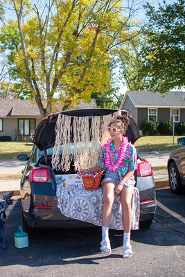 Senior Ayah Habhab, dresses up as Lilo from the disney movie Lilo and Stitch, waiting to hand out candy.
