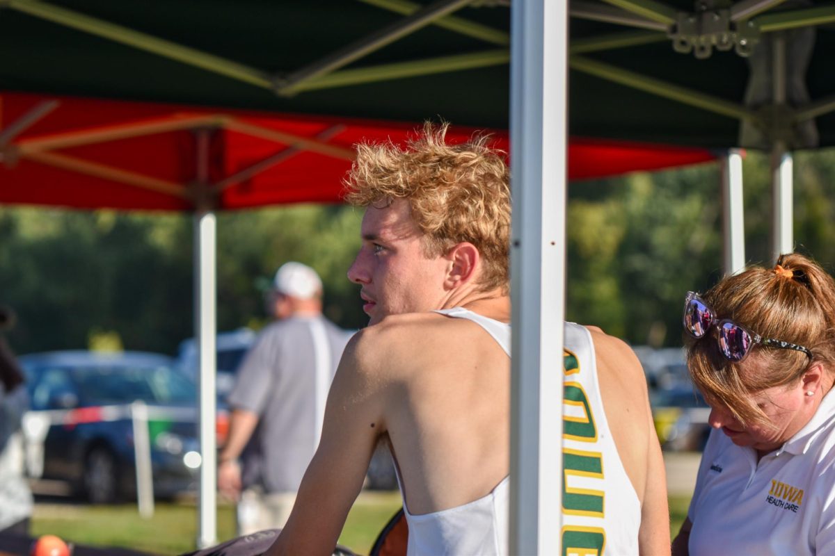 After the meet, Senior Noah Penn watches the rest of the team finish their race.