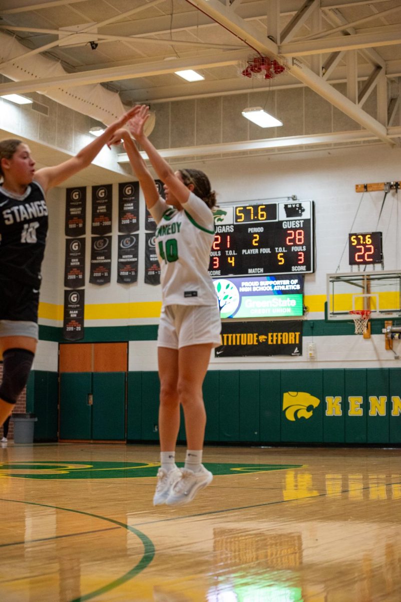 With her first three point attempt of the game junior Lola Sain scores over the Mount Vernon defender. 