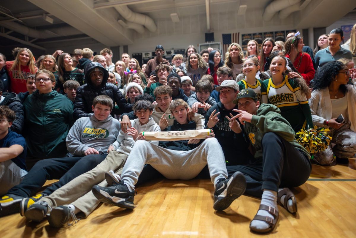Posing after winning the "Spirit Stick", the sophomores celebrate their win in the winter pep assembly.