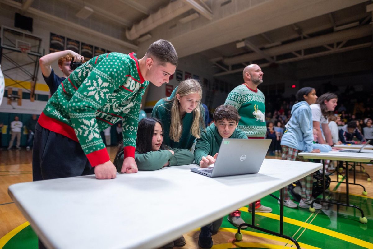 Juniors Christian Maybanks, Lucy McCord, Liliana Hansen, and Griffin Mann work together in the trivia challenge.