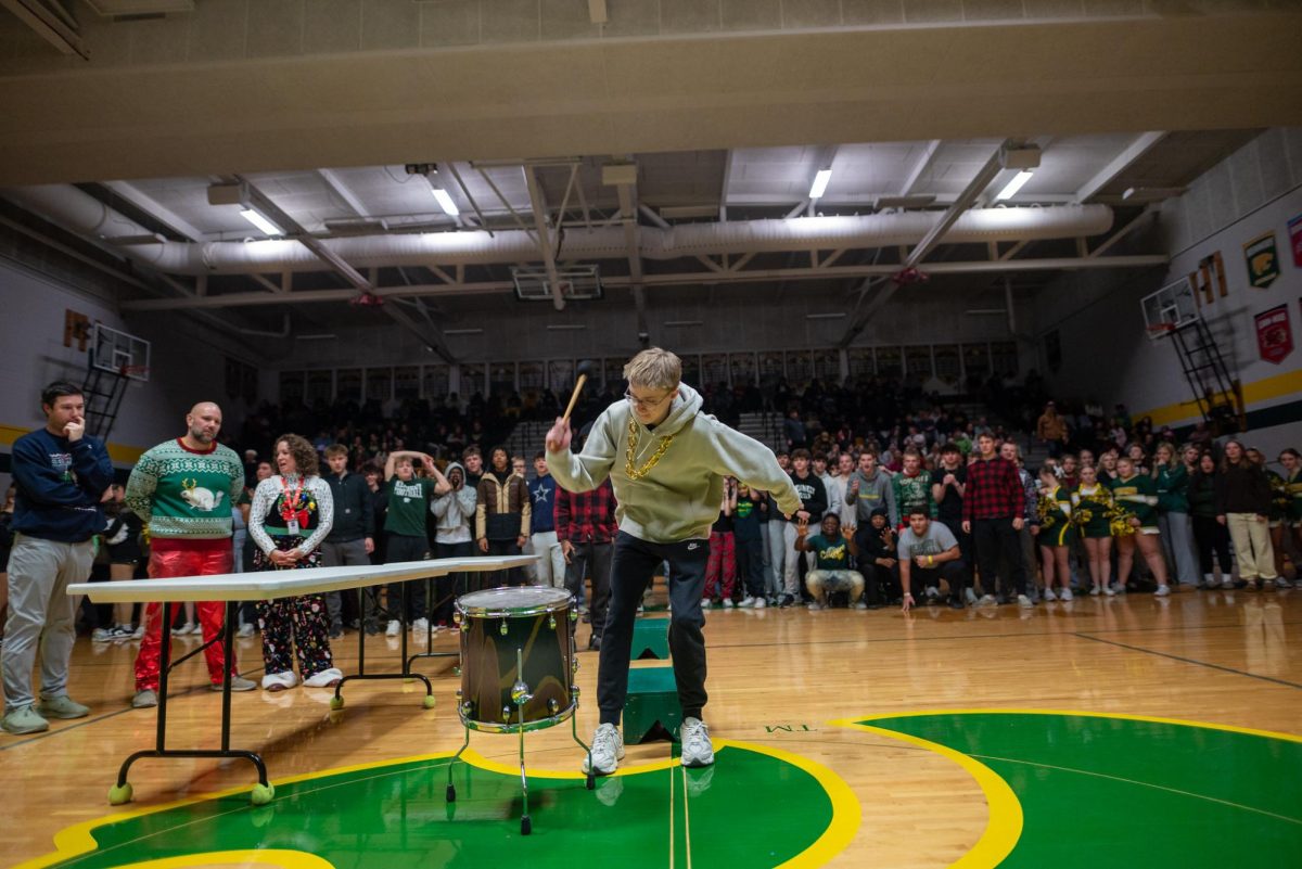 Junior Jack Allen bangs the drum to the beat of Whitney Houston to win the juniors a point.