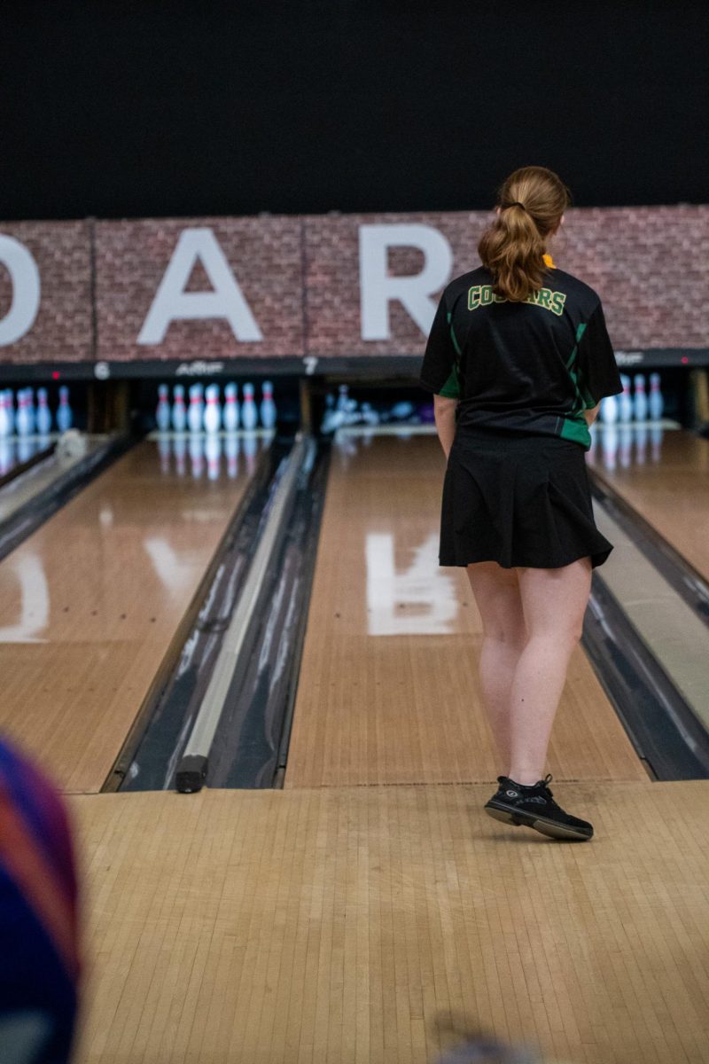 Pumping a celebratory fist, senior Daisy Slater reacts to her strike.