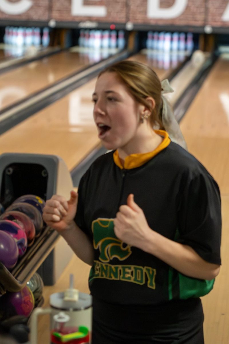 Expressing her enthusiasm, senior Kaiya Gralund celebrates after getting a strike.