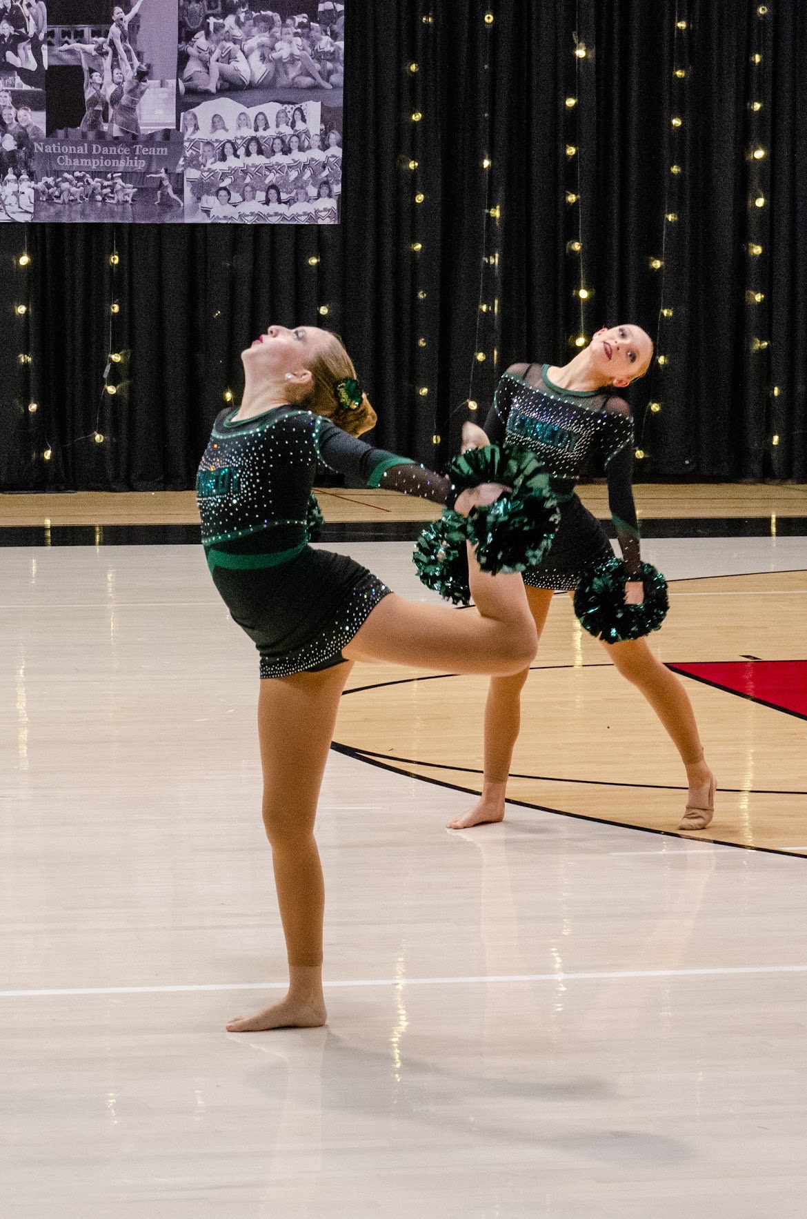 Freshman Charlotte Houghkirk displays her flexibility while dancing. Houghkirk competed with the Kennedy dance team at the Linn-Mar Lineage dance competition on November 1. 