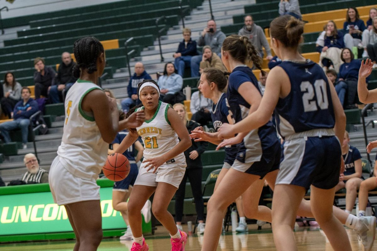 Looking at senior Dureti Ali, freshman Emayah Smith prepares for a pass.