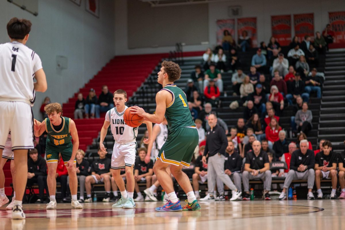 Shooting his second free throw, junior Jaxson Bean looks to improve upon the Kennedy lead.