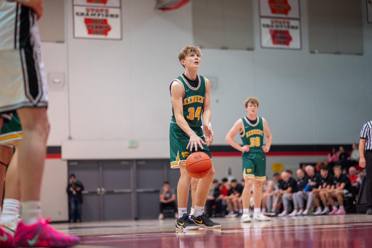 Standing at the line after getting fouled, freshman Brooks Greenlee gets ready to shoot his two.