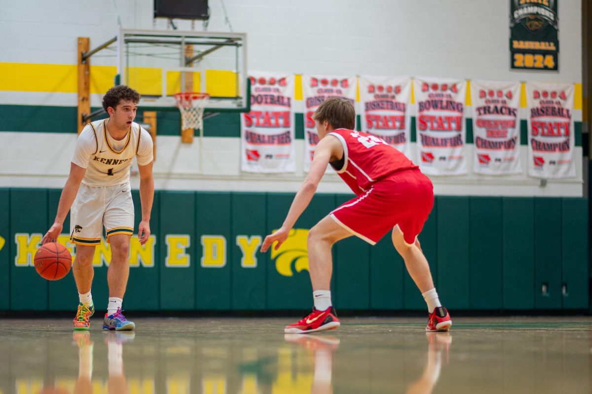 Keeping his eyes up dribbling down the court, junior Jaxson Bean scans for his next move.