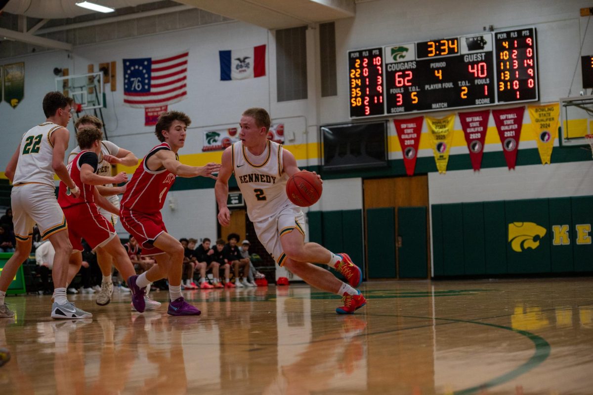 Cutting to the basket, freshman Drew McKowen looks to score his 12th point of the game.