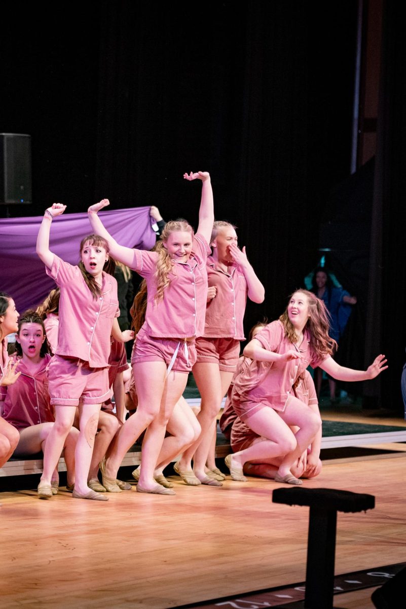 Sophomores Brae Sullivan, Destiny Blegen, Alli Parks and Melody Hubbard reveal their costume change at Prairie High school, February 1.