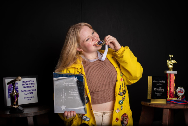 After winning Best Solist, Izzy Westercamp '26 shows off her awards. 